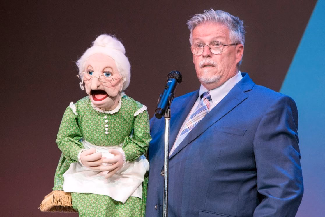 Al Getler and Miss McNeely performing live onstage.